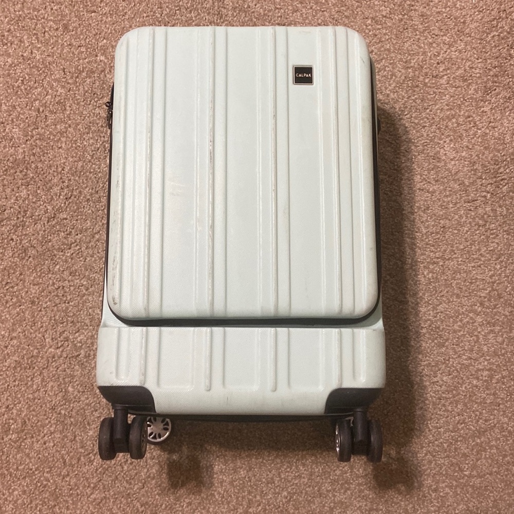 Light Blue/Teal Calpak Carry-On with Front / laptop Pocket & in USED condition